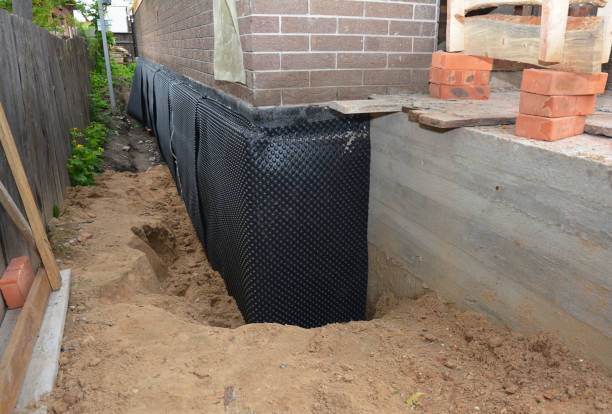 Happy homeowners after waterproofing job in Phenix City